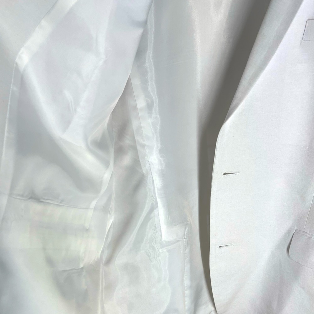 Two-piece cotton and linen blend. Recently dry cleaned and only worn twice.